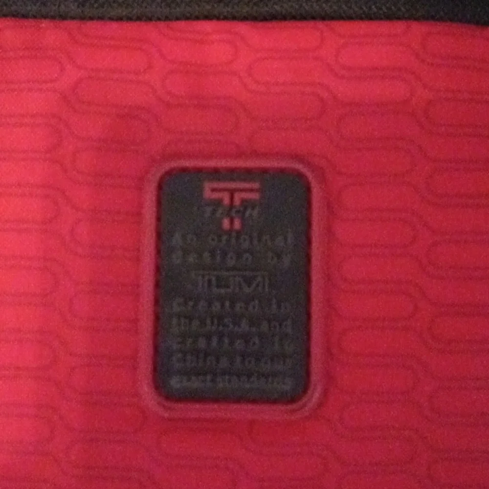 Tumi Black Laptop Messenger Bag.